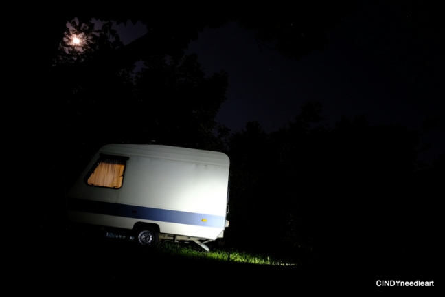 Small Adria caravan under a full moon